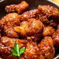 Fried BBQ Cauliflower · Cauliflower florets fried in a chickpea flour and tossed in a sweet and spicy BBQ sauce.