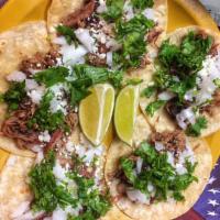 Walk Off · 5 mini corn tortillas with your choice of brisket or beef fajita, onion, cheese, cilantro.