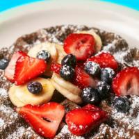 Iron, Lion, Zion Waffle · Buckwheat with blueberries, bananas and strawberries. Gluten free.