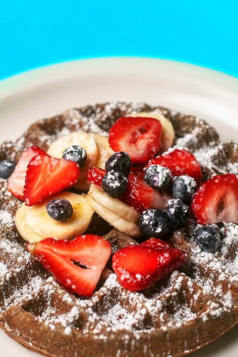 Iron, Lion, Zion Waffle · Buckwheat with blueberries, bananas and strawberries. Gluten free.