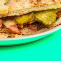 Cuban Sandwich · Pulled pork, sliced ham, pickle, Swiss cheese and mustard.