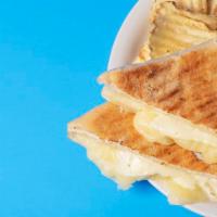Grilled Cheese Sandwich · Mozzarella and cheddar. Add tomato or pesto, ham or bacon for an additional charge.