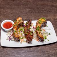 Sweet Chili Ribs · Slow cooked baby back ribs glazed with our sweet Thai chili sauce.