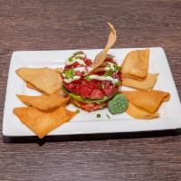 Ahi and Avocado Stack · Diced ahi tuna, avocado, cucumber, onion and tomato with wasabi aioli and hoisin.