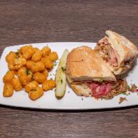 Cubano Sandwich · Pulled pork, smoked ham, Swiss, pineapple coleslaw, pickled red onions, creole mustard, tort...