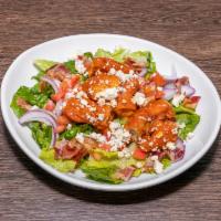 Buffalo Chicken Salad · Romaine, crispy Buffalo chicken, bacon, blue cheese crumbles, tomato, red onions, blue chees...