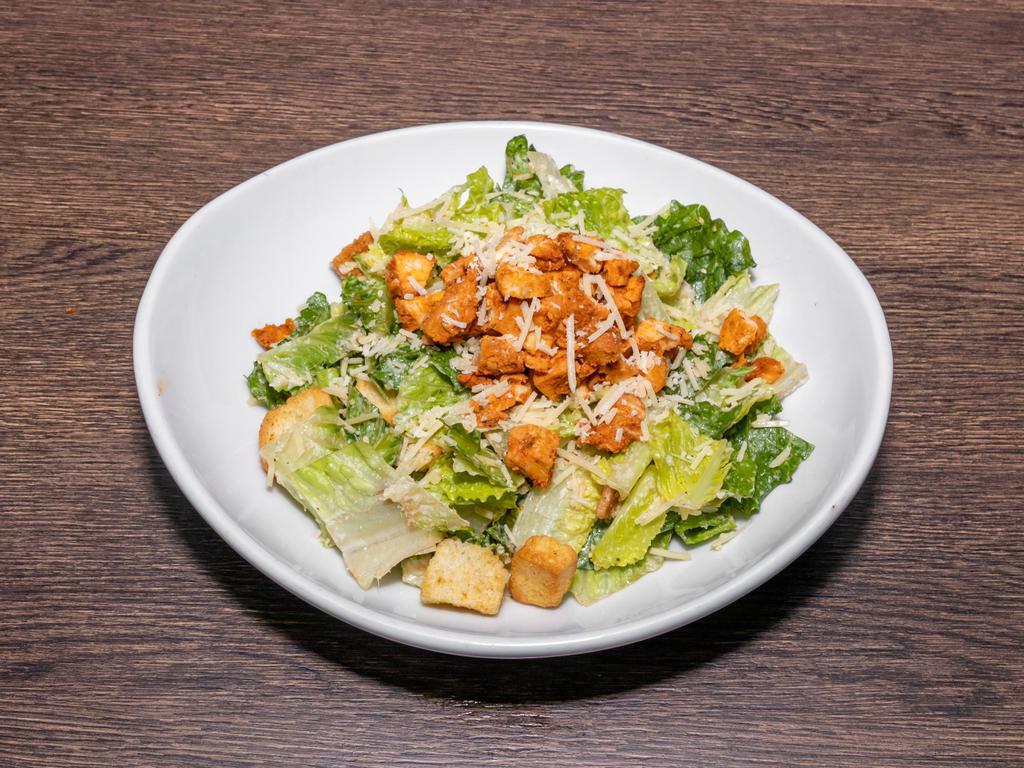 Caesar Salad · Romaine, Parmesan cheese, red onions, garlic croutons, add grilled chicken for an additional charge.