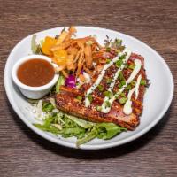 Ahi Tuna Salad · Seared ahi, mixed greens, wonton strips, mandarin oranges, scallions, wasabi aioli, Asian dr...