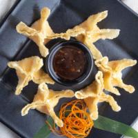 Crispy Crab Wontons · Golden wontons filled with crab and cream cheese, delicately seasoned and served with sweet ...
