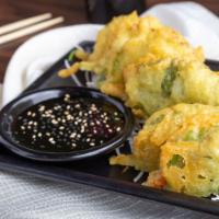 Dragon Scales · Spicy tuna delicately pressed between 2 Japanese shiso leaves then lightly tempura fried, se...