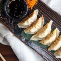 Vegetable and Pork Pot Stickers · Pan seared Asian dumplings served with a citrus soy dipping sauce.