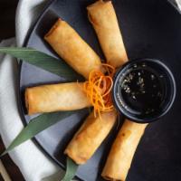 Veggie Spring Rolls · Shredded veggies wrapped in delicate rolls, golden fried and served with ponzu sauce.