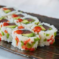 Baja Roll · Spicy tuna, avocado and cilantro topped with jalapenos and Sriracha sauce.