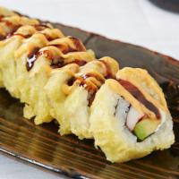 Vegas Roll · Salmon, crab, avocado and cream cheese, tempura dipped, topped with Sumo sauce and sweet sau...