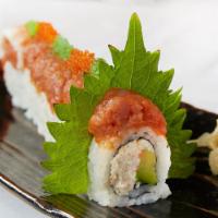 Dragon Roll · Crab salad and avocado topped with shrimp, spicy tuna, ebi and tobiko.