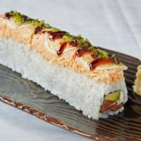 Rising Sun Roll · Salmon, avocado and cream cheese topped with spicy crab salad, green onions, lemon and sweet...