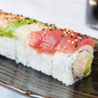 Rainbow Roll · Crab salad and avocado, topped with 5 types of sashimi and sesame seeds.