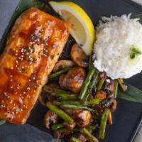 Miso Glazed Salmon · Fresh line caught salmon fillet topped with a red miso and ginger glaze topped with fresh ba...