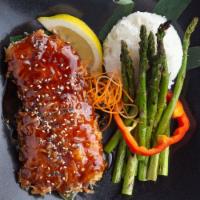 Coconut Crusted Halibut · Fresh pan-seared halibut steak crusted with coconut and topped with our Korean BBQ sauce and...