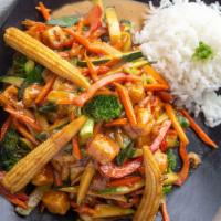 Thai Peanut Stir Fry · Tender white chicken breast and stir-fried veggies on a bed of steamed rice, served with our...