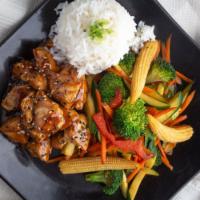 Teriyaki Tori · Bite size pieces of white chicken breast glazed with teriyaki sauce, served with steamed ric...