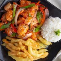 Sweet and Sour Chicken · Flash-fried white chicken breast with pineapple, green peppers and onions served with rice a...