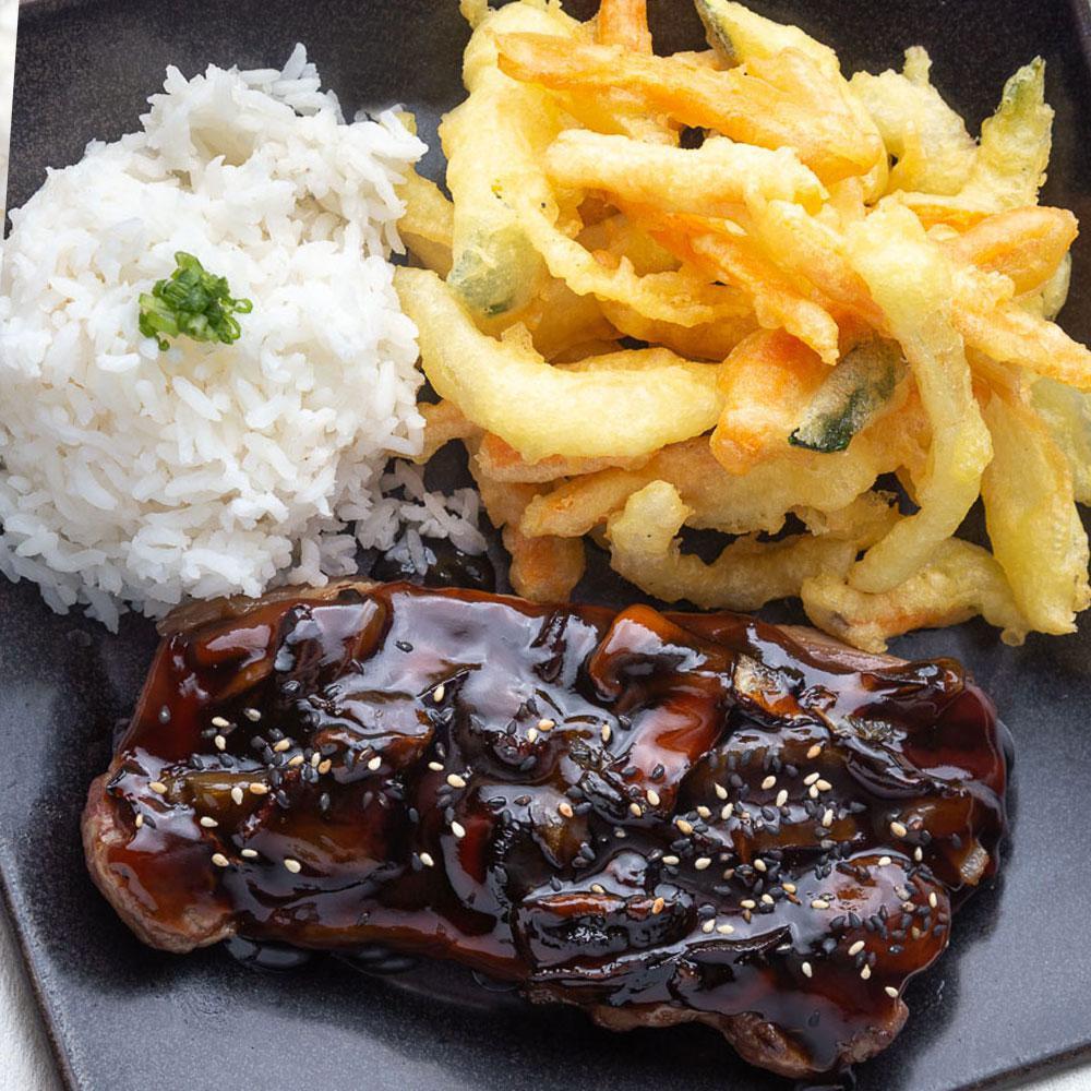 Samurai Steak · 10 oz. certified Angus beef New York strip loin topped with mushrooms, onions and teriyaki sauce served with steamed rice and stir-fried or tempura veggies.