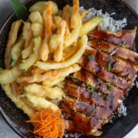 Teriyaki Chicken Bowl · Tender grilled chicken breast and our delicious teriyaki sauce served with tempura vegetable...