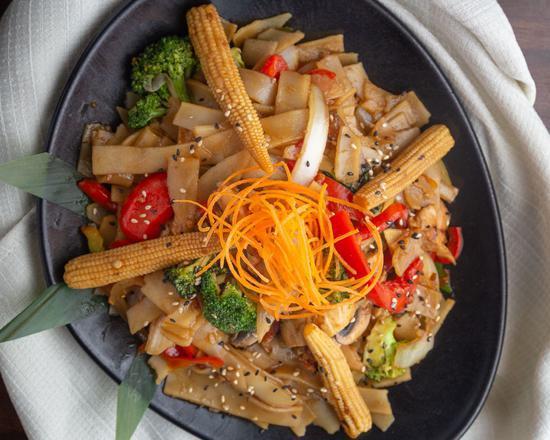 Siam Street Noodles · Spicy Asian flat noodles pan sauteed with Thai chilies, basil, garlic and seasonal veggies with your choice of protein.