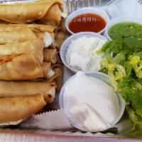 20 cheese taquitos fritos · 20 Fried rolled tortilla stuffed with cheese. crema Mexicana, cotija cheese, home-made hot s...
