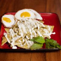 Chilaquiles Verdes · Deep fried Corn chips smothered in a red guajillo sauce mild to medium spicy. crema Mexicana...