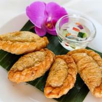 Curry Puff · Minced Chicken, Potatoes, and Onions cooked with curry powder and served with sweet cucumber...