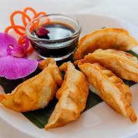 Gyoza · Pork Dumplings. Fried ground pork with vegetables. Served with Sweet Soy Sauce.