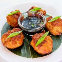 Fried Dumplings · Ground Chicken and Shrimps, water chestnuts and shiitake mushrooms served with tangy soy sau...