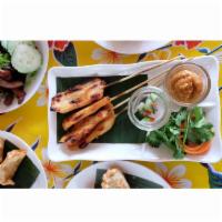 Chicken Satay · Grilled marinated chicken on skewers, served with peanut sauce, cucumber relish, and grilled...