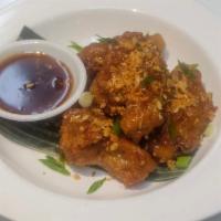Garlic Sauce Chicken Wings  · Deep fried special marinated wings served with Garlic sauce.