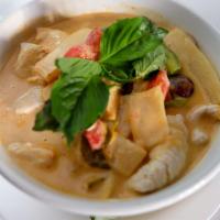 Red Curry · Authentic Thai Red Curry in Home Made Style with eggplants, bamboo shoots, string beans, bel...