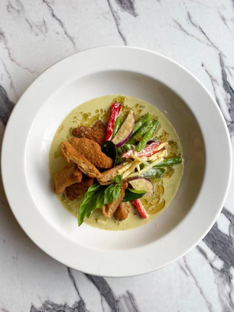Vegan Green Curry  · Authentic Thai Style Green Curry in Vegan option with eggplant, bamboo shoots, string beans, bell peppers & bell leaves with coconut milk. Served with Rice. Spicy. Gluten free.