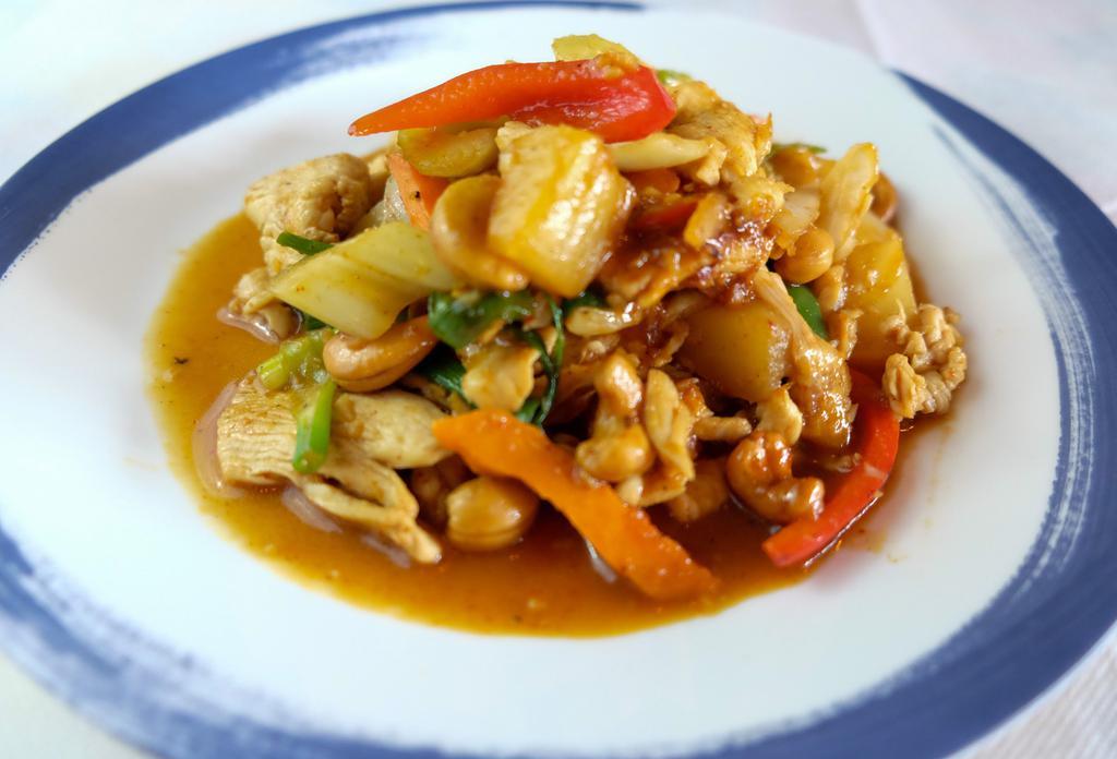 Vegan Pad Cashew Nut · Sautéed batter fried tofu or vegetable, Pineapple, cashew nut, bell peppers, scallions and celeries with chili jam. Served with Rice. Spicy