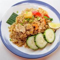 Vegan Pineapple Fried Rice · Hawaiian pineapple, cashew nuts, tomatoes, onions, scallions and carrots mixed with rice and...