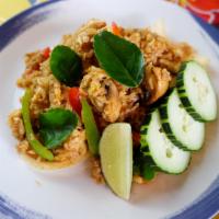Tom Yum Fried Rice · Zesty Rice with Thai Herb, egg, mushrooms, onions and bell pepper with special Tom yum chili...