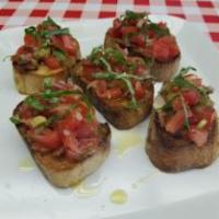 Bruschetta · Diced tomatoes, onions, herbs and garlic, and served over toasted crustinis. Topped with ext...