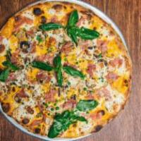 Pizza Alla Vodka Specialty Pizza · Fresh sliced mozzarella, our famous tomato cream vodka sauce, seasoned fresh mushrooms, peas...