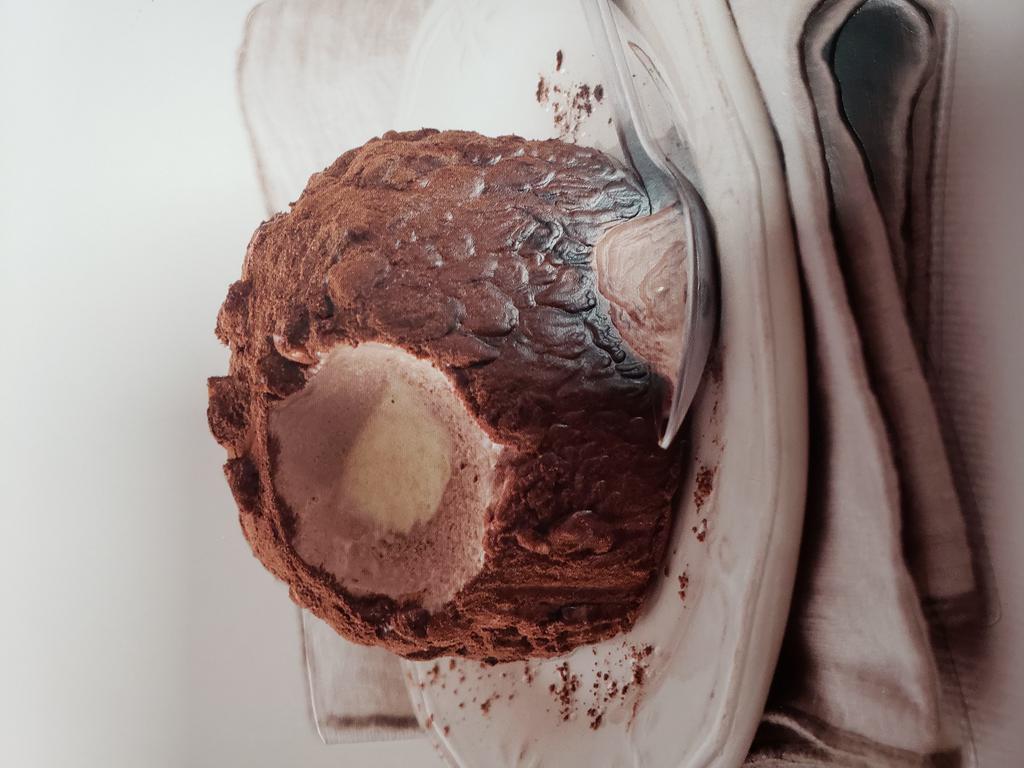 CHOCOLATE TRUFFLE · Zabaione semifreddo surrounded by chocolate Gelato and caramelized  hazelnuts topped with cocoa powder 