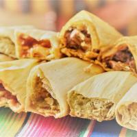 two tamales with rice and bean · choice of meat chicken ,pork and cheese with poblano strips
