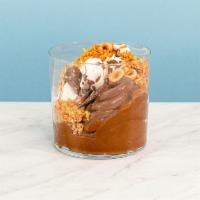 Praline Pud · This decadent hazelnut-praline pudding combines rich chocolate pudding with a layer of hazel...