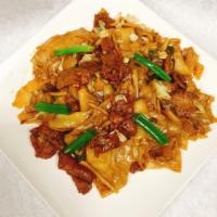 Pas See Ew with Beef · Stir fried flat rice noodles with vegetables, egg and soy sauce.