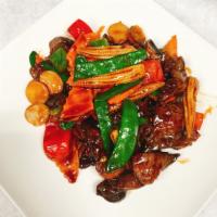 Thai Spicy Beef · Sliced beef with black mushroom, snow peas, carrots, baby corn and pepper in special soy sau...