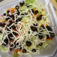 Garden Salad · Lettuce, carrots, red onions, tomatoes, cucumber, black olives and cheese.