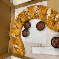Supreme Calzone · Pepperoni, sausage, beef, onion, black olives, mushrooms, green peppers and cheese.